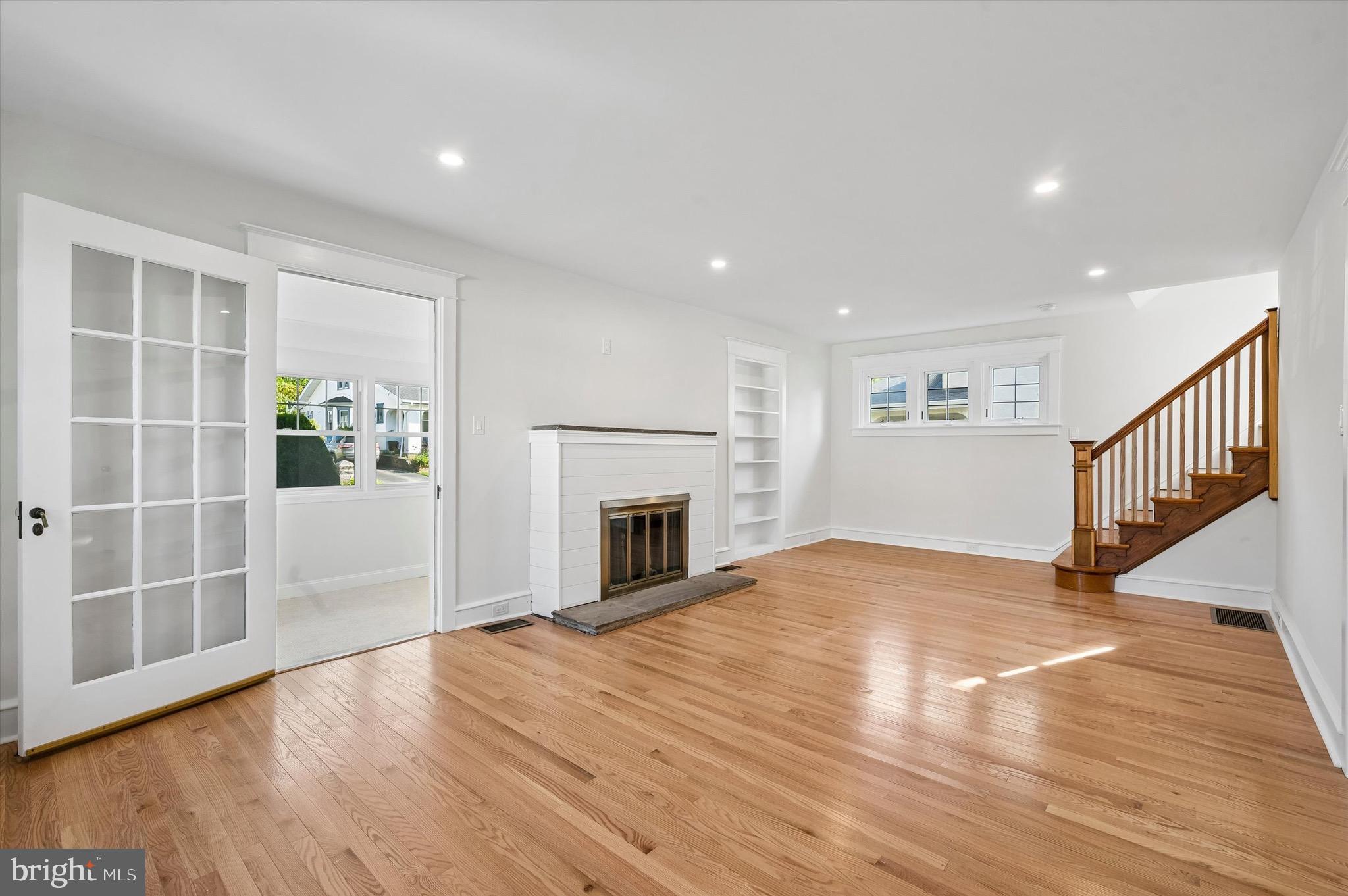 100 Yale Road Havertown, PA 19083 - Photo 4 of 35 a view of empty room with wooden floor and fireplace