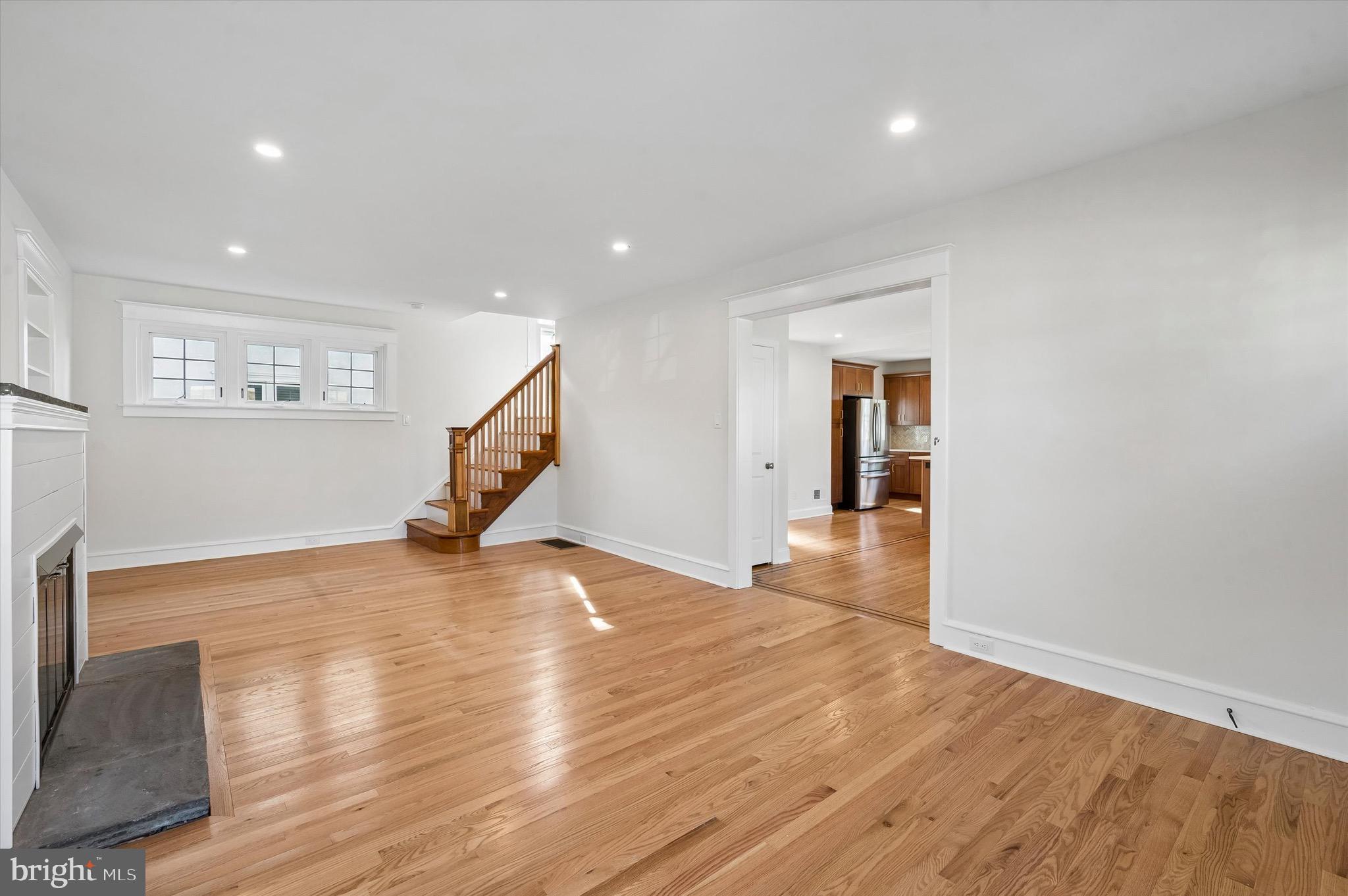 100 Yale Road Havertown, PA 19083 - Photo 5 of 35 a view of an empty room with wooden floor and stairs