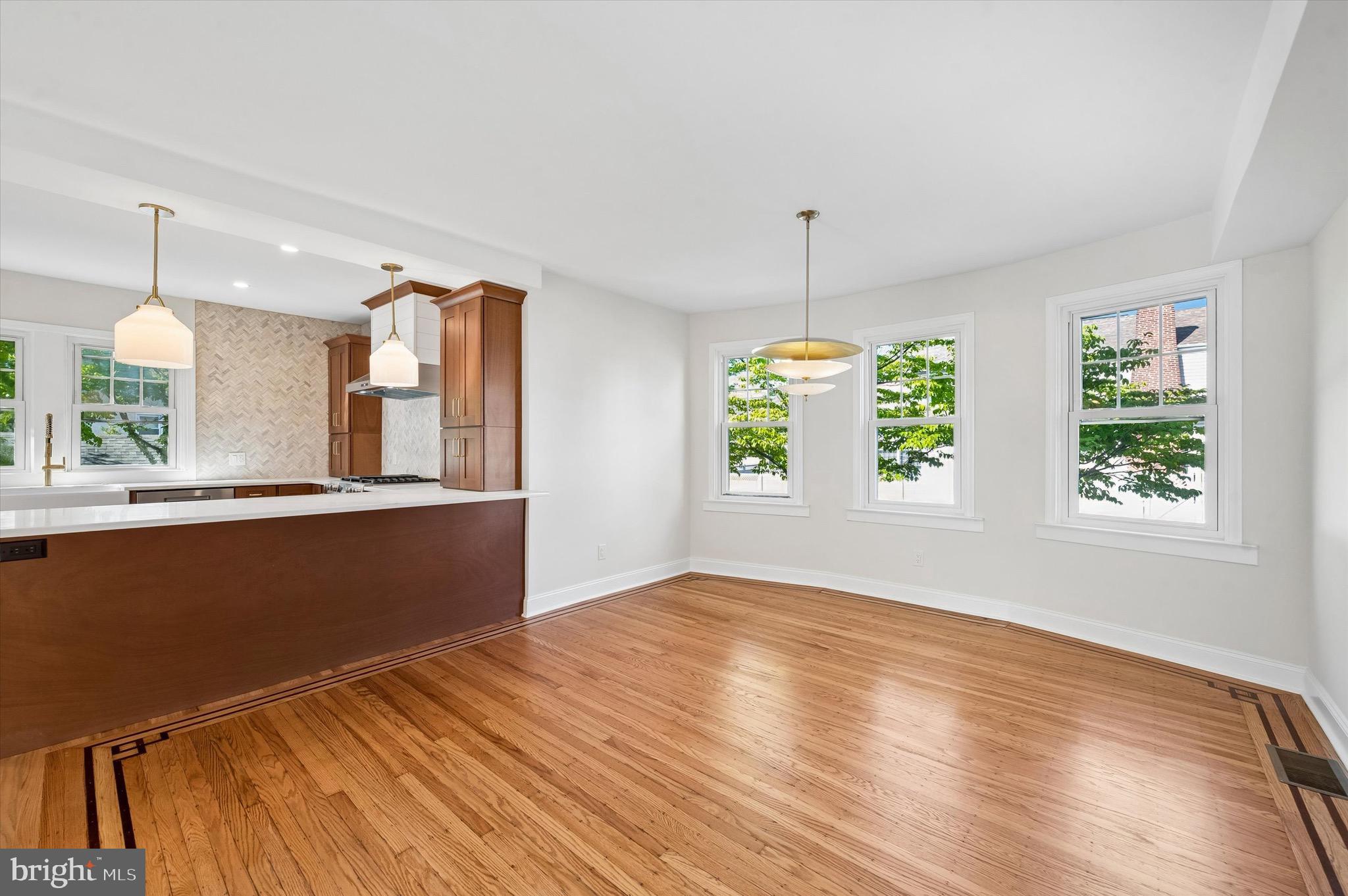 100 Yale Road Havertown, PA 19083 - Photo 8 of 35 a view of an empty room with window and wooden floor
