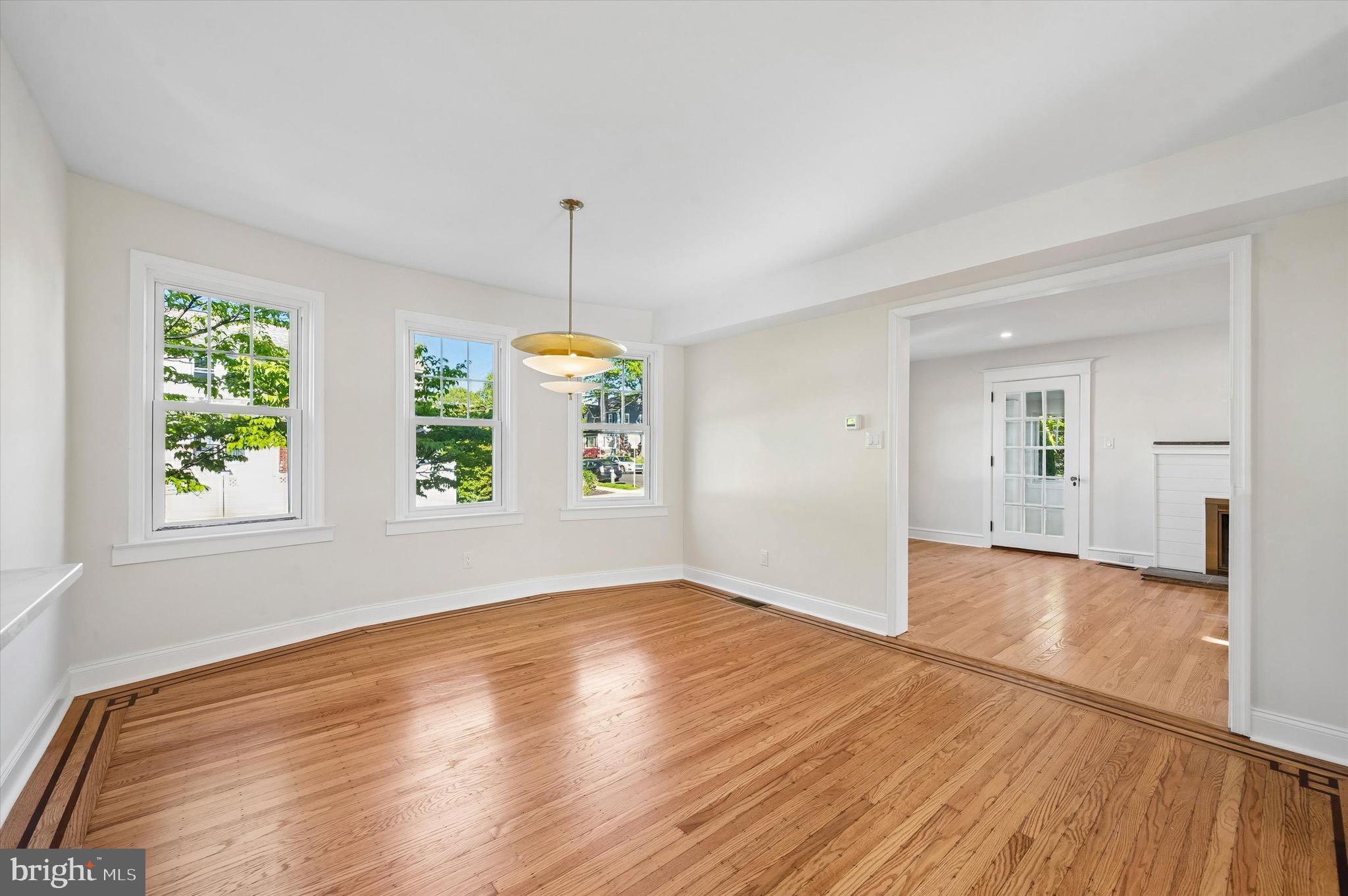 100 Yale Road Havertown, PA 19083 - Photo 9 of 35 an empty room with wooden floor and windows