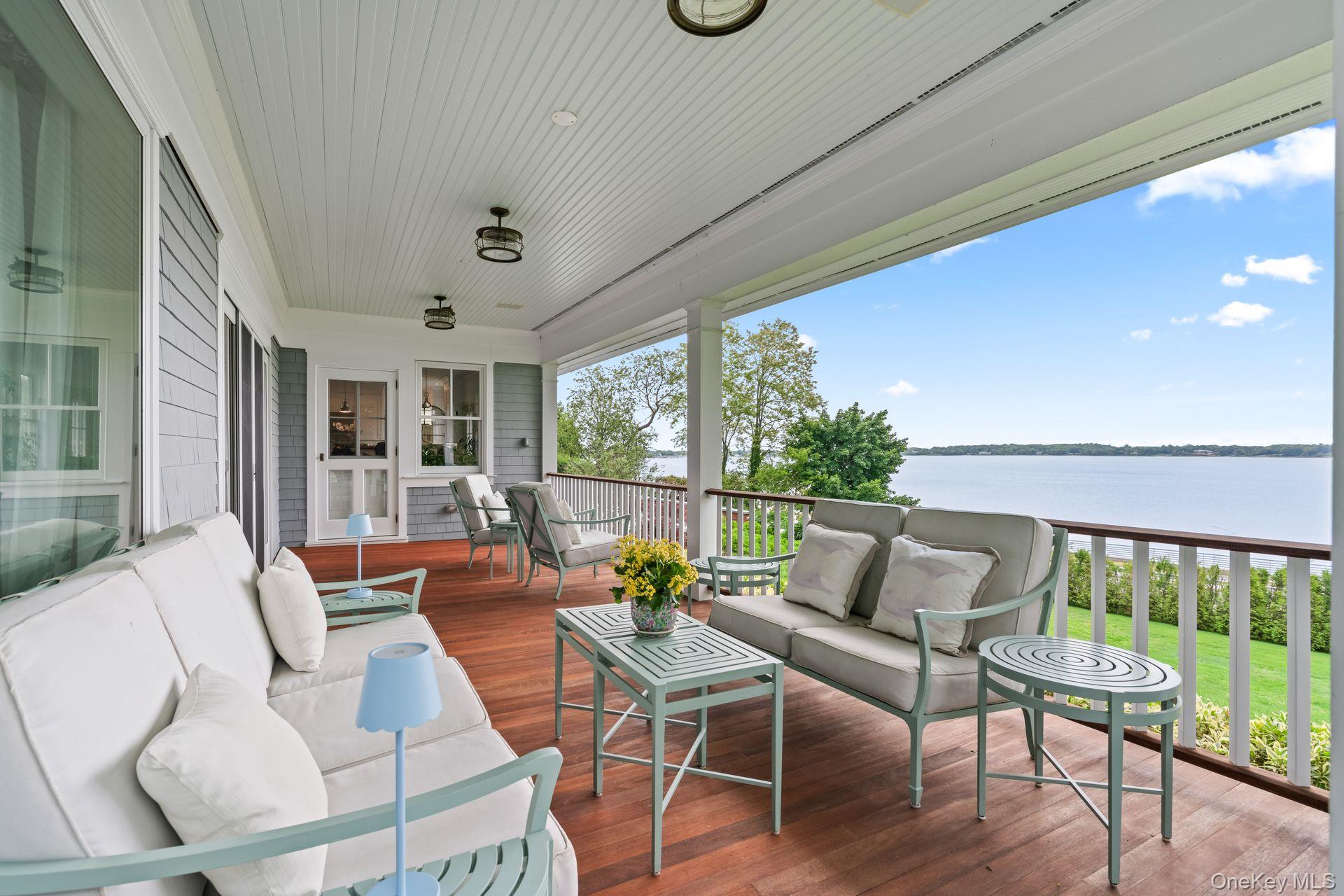 998 West Shore Road Mill Neck, NY 11765 - Photo 13 of 36 a living room with furniture and a large window
