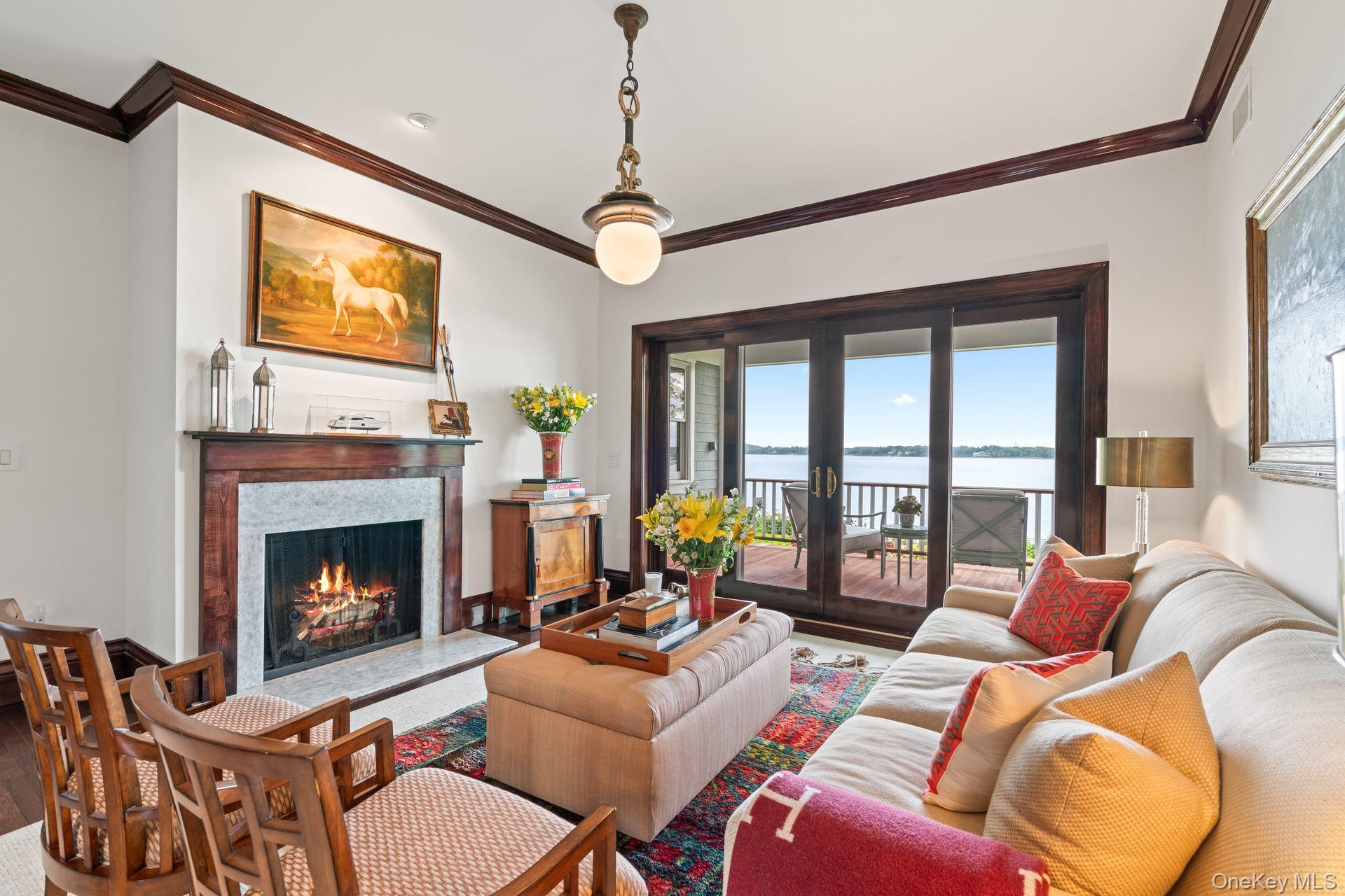 998 West Shore Road Mill Neck, NY 11765 - Photo 14 of 36 a living room with furniture a fireplace and a flat screen tv
