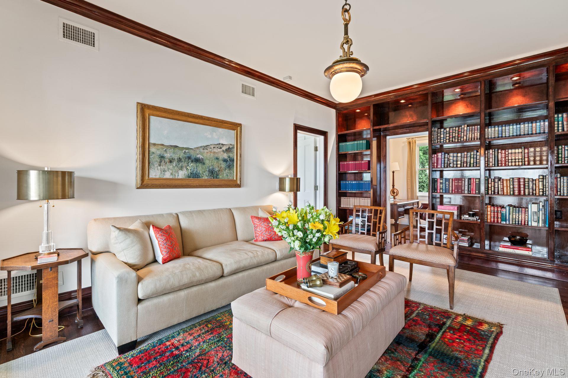 998 West Shore Road Mill Neck, NY 11765 - Photo 15 of 36 a living room with furniture and flowers