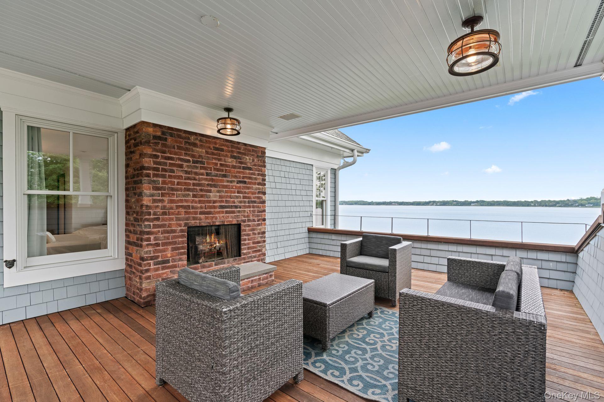 998 West Shore Road Mill Neck, NY 11765 - Photo 21 of 36 a living room with furniture and a fireplace