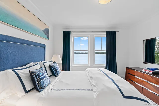 a bedroom with bed and window