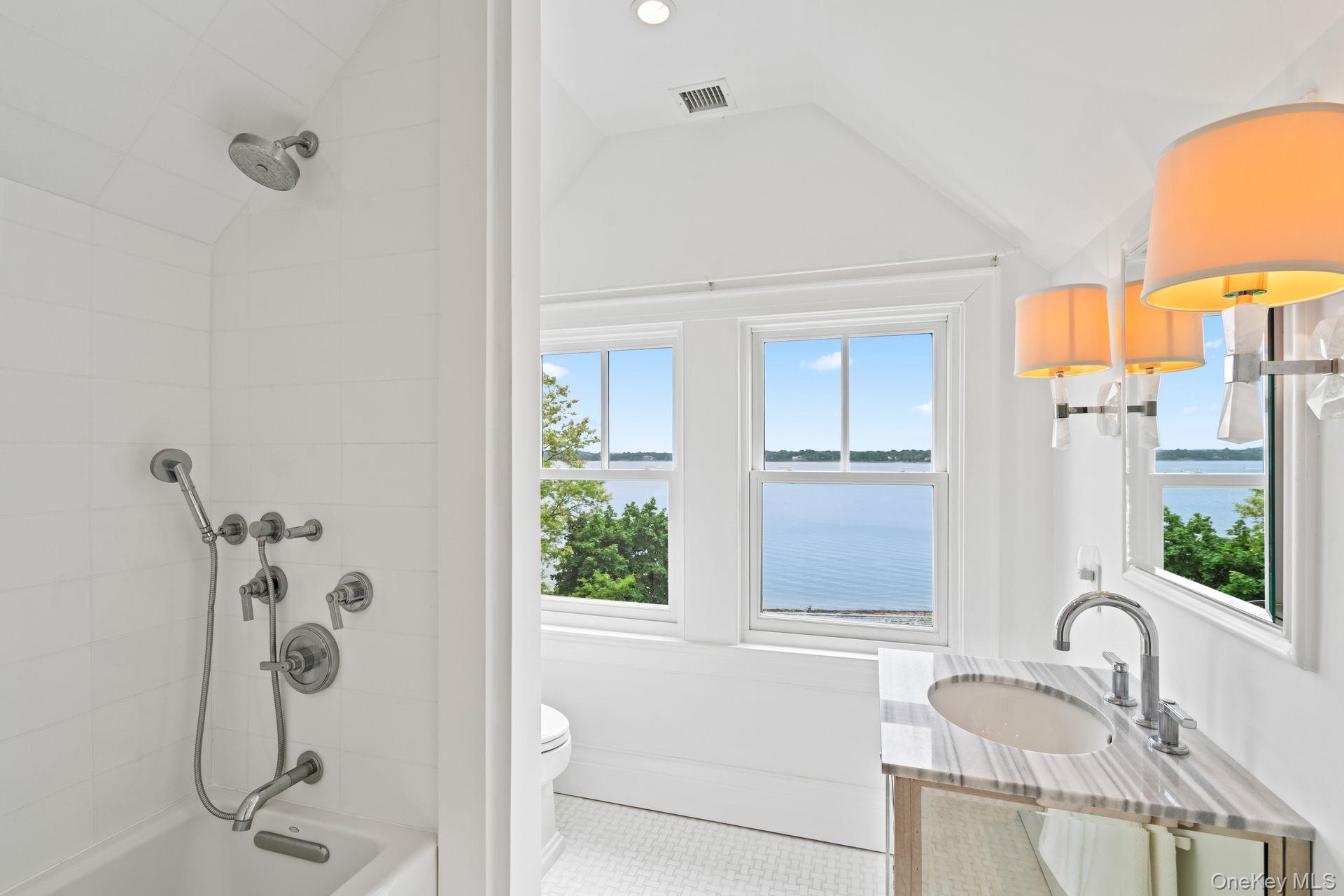 998 West Shore Road Mill Neck, NY 11765 - Photo 25 of 36 a bathroom with a granite countertop sink and a shower