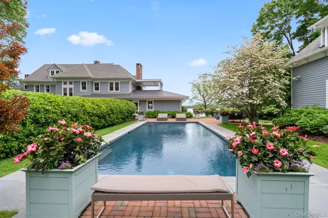 a view of a house with a yard and a garden