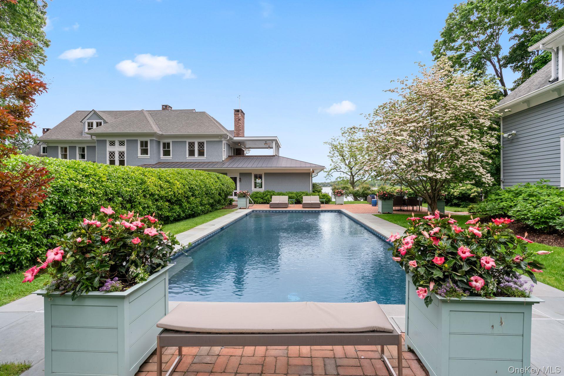 998 West Shore Road Mill Neck, NY 11765 - Photo 29 of 36 a view of a house with a yard and a garden
