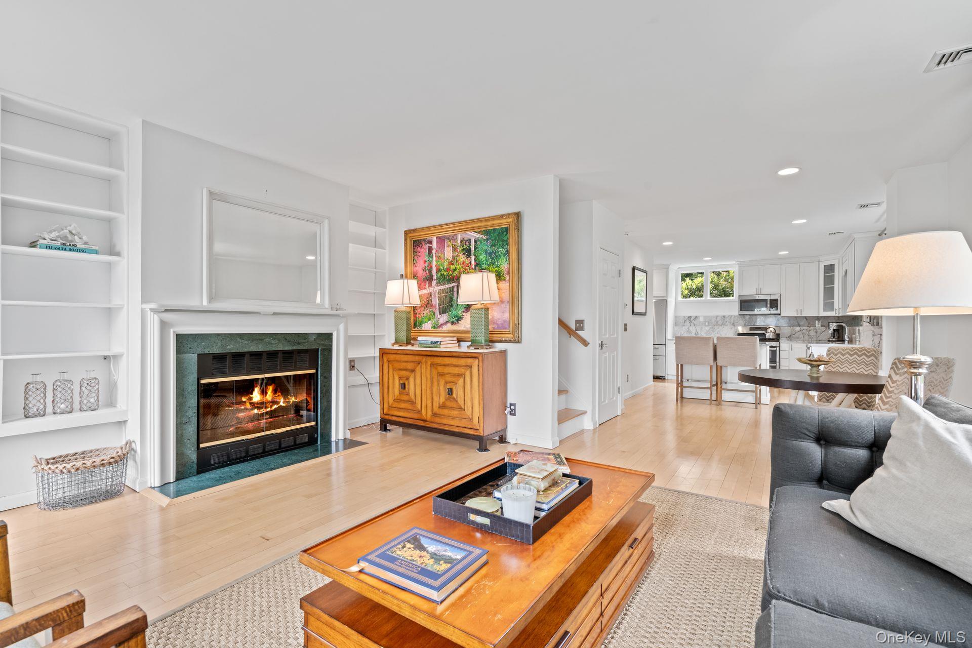 998 West Shore Road Mill Neck, NY 11765 - Photo 31 of 36 a living room with furniture and a fireplace