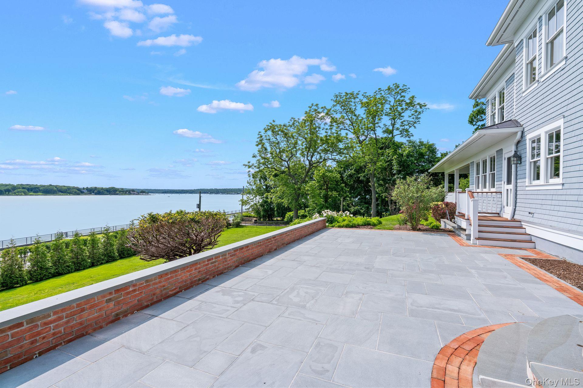 998 West Shore Road Mill Neck, NY 11765 - Photo 35 of 36 a view of a garden with an outdoor seating