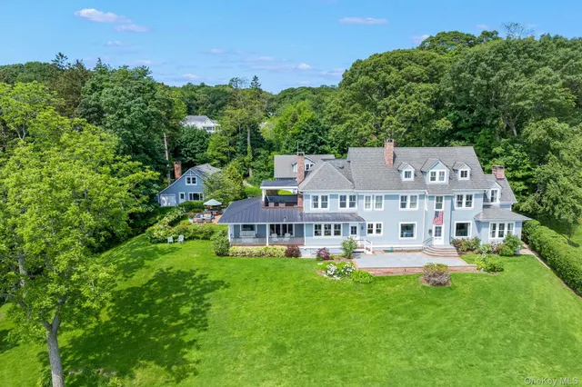 an aerial view of a house with swimming pool garden and mountain view