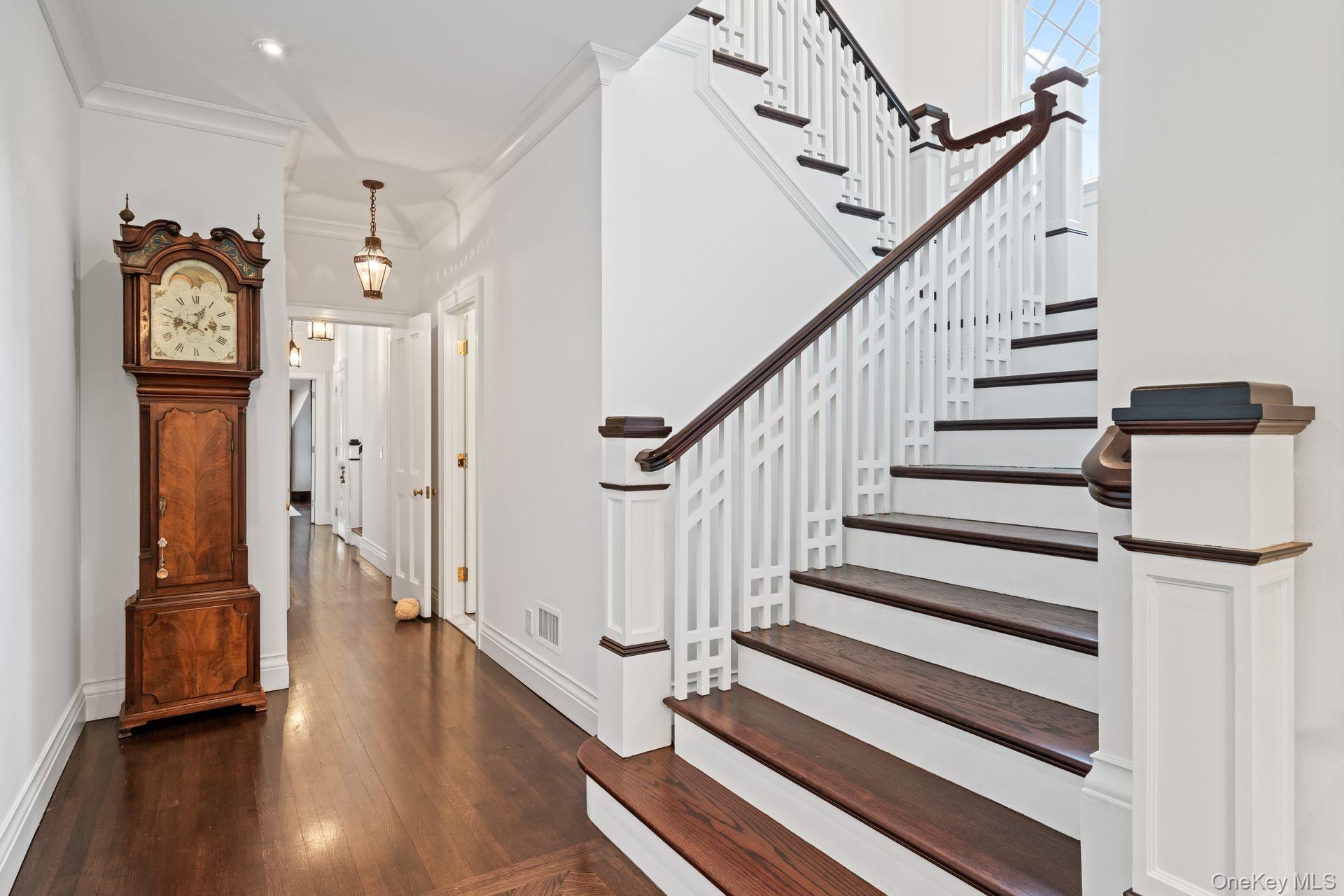 998 West Shore Road Mill Neck, NY 11765 - Photo 4 of 36 a view of a hallway with wooden floor and staircase