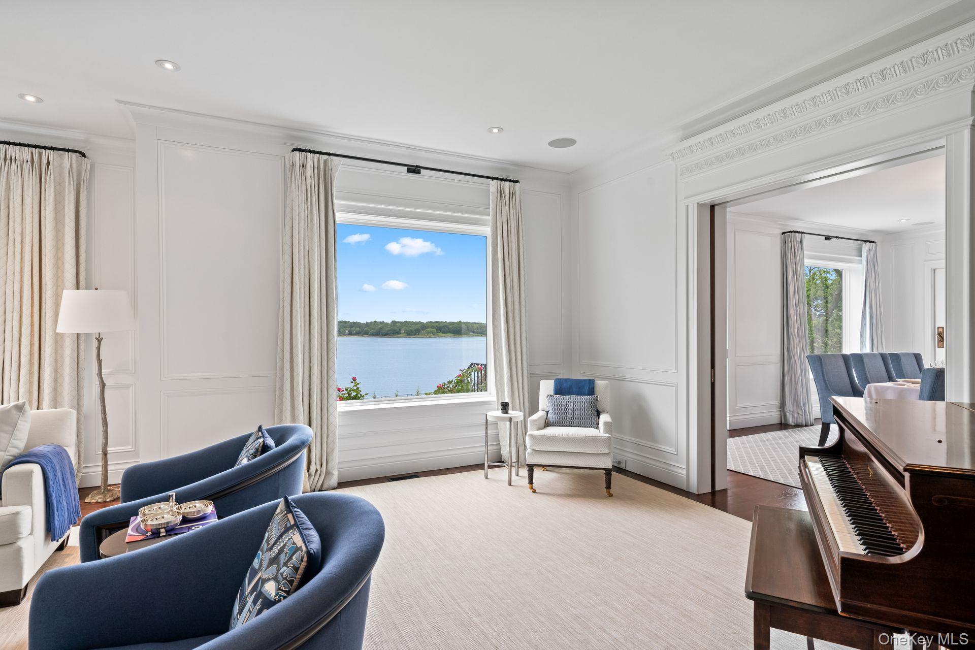 998 West Shore Road Mill Neck, NY 11765 - Photo 6 of 36 a living room with furniture and a large window