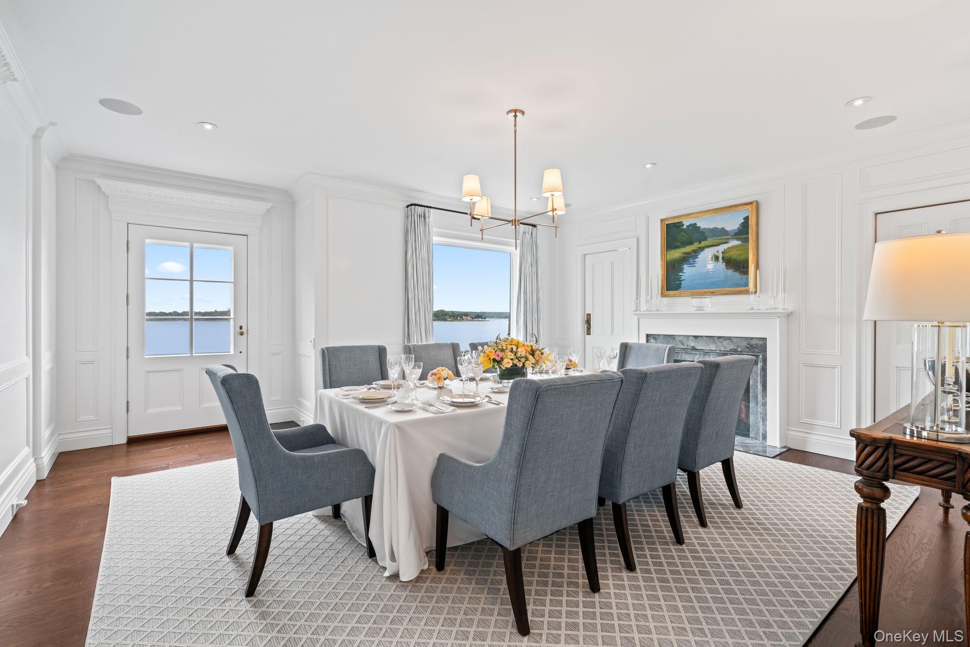 998 West Shore Road Mill Neck, NY 11765 - Photo 7 of 36 a view of a dining room with furniture and wooden floor