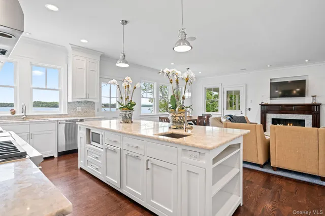 a kitchen with sink stove and cabinets