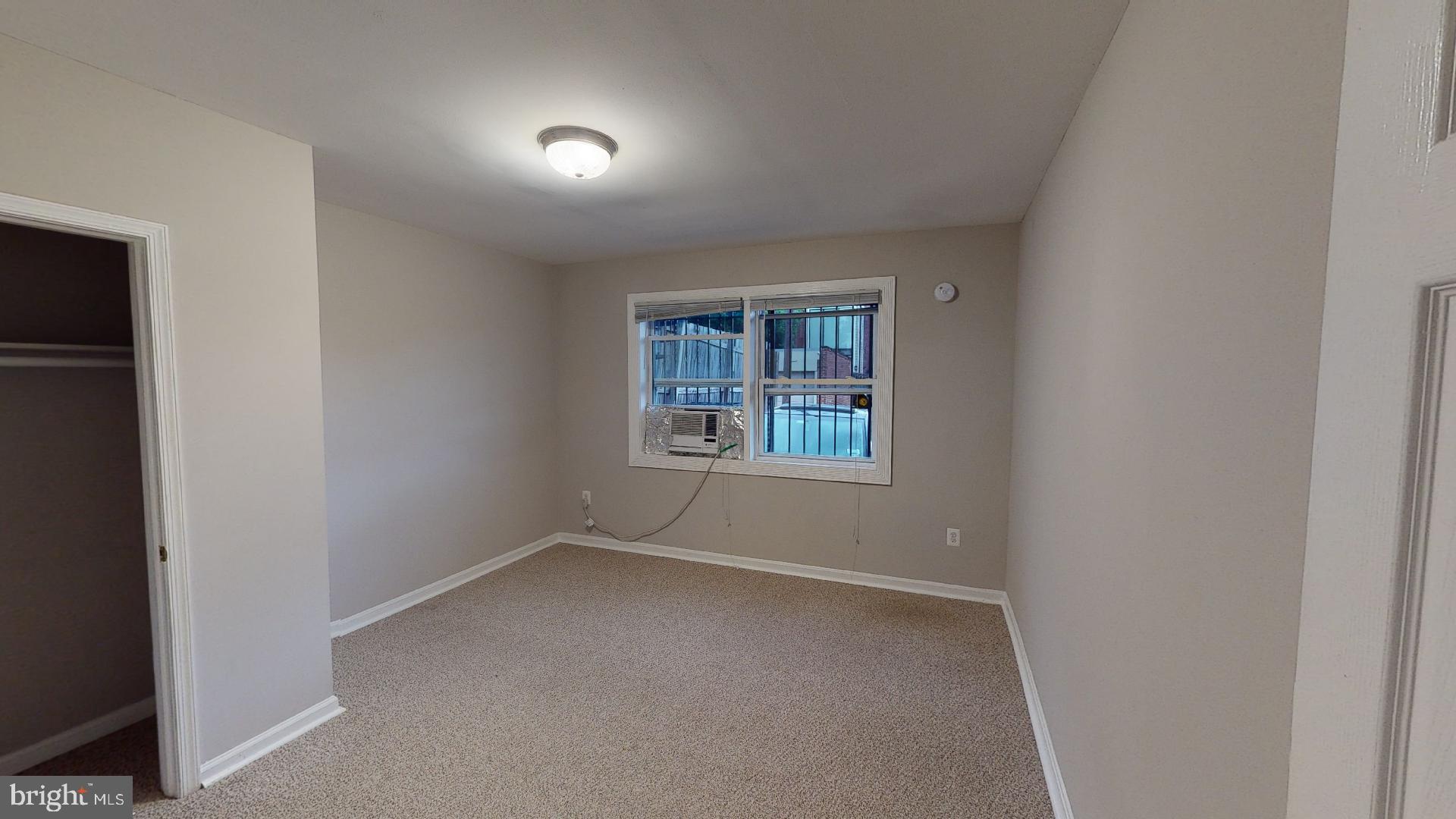 1133 Euclid Street Northwest, Unit B Washington, DC 20009 - Photo 4 of 11 an empty room with windows