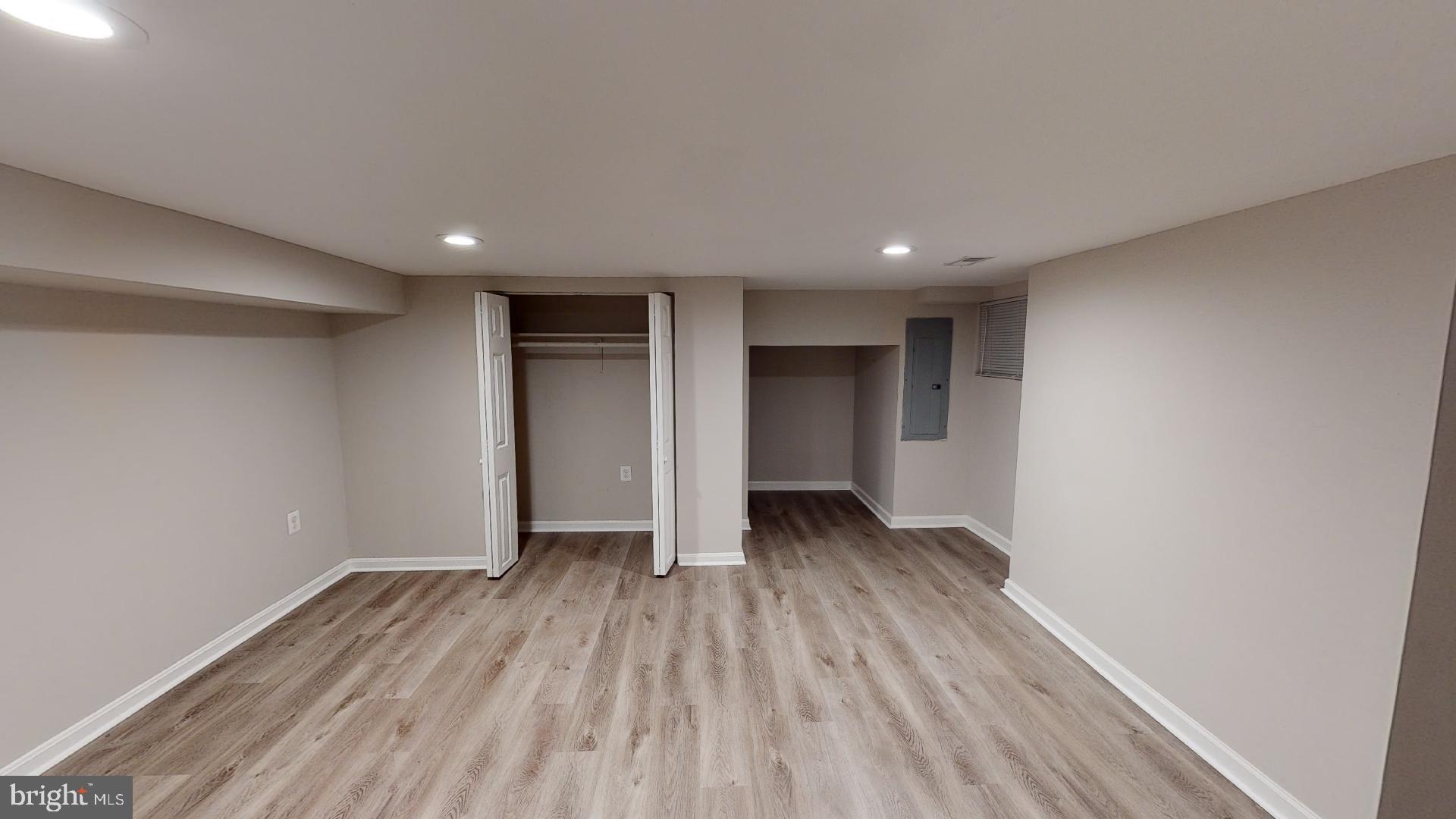 1133 Euclid Street Northwest, Unit B Washington, DC 20009 - Photo 6 of 11 a view of an empty room with wooden floor