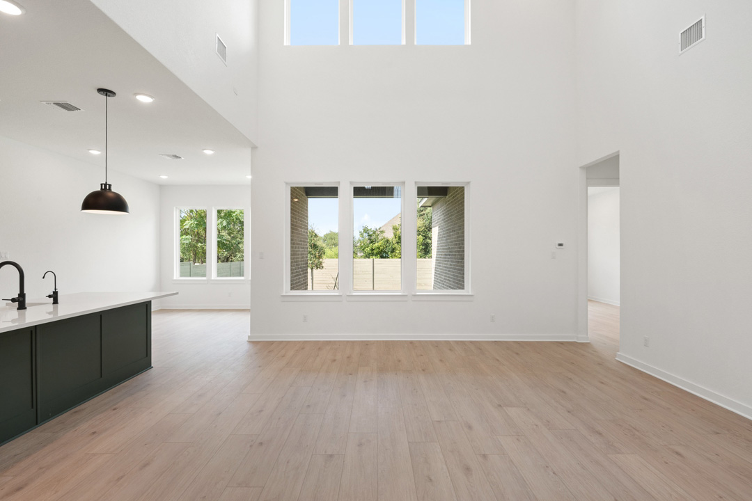 1114 Blue Moon Drive Georgetown, TX 78628 - Photo 11 of 39 an empty room with wooden floor and windows