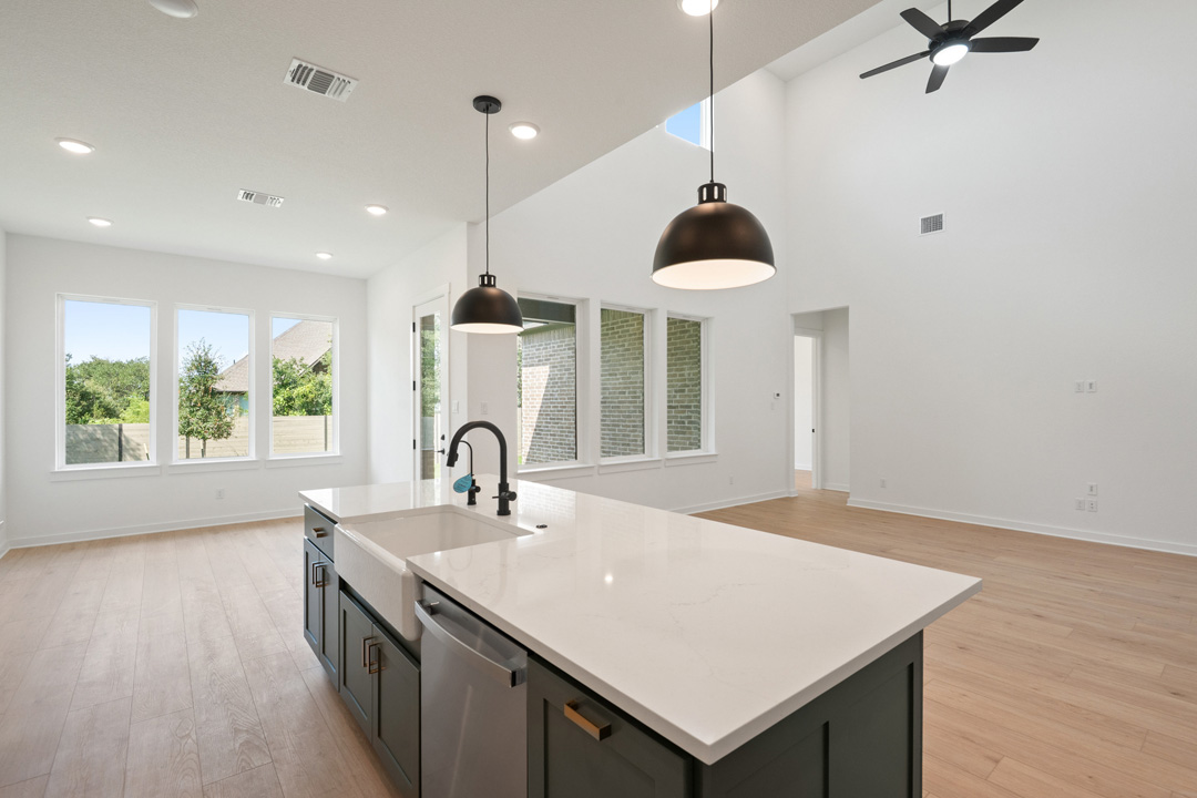 1114 Blue Moon Drive Georgetown, TX 78628 - Photo 13 of 39 a kitchen with a sink a counter space and a window