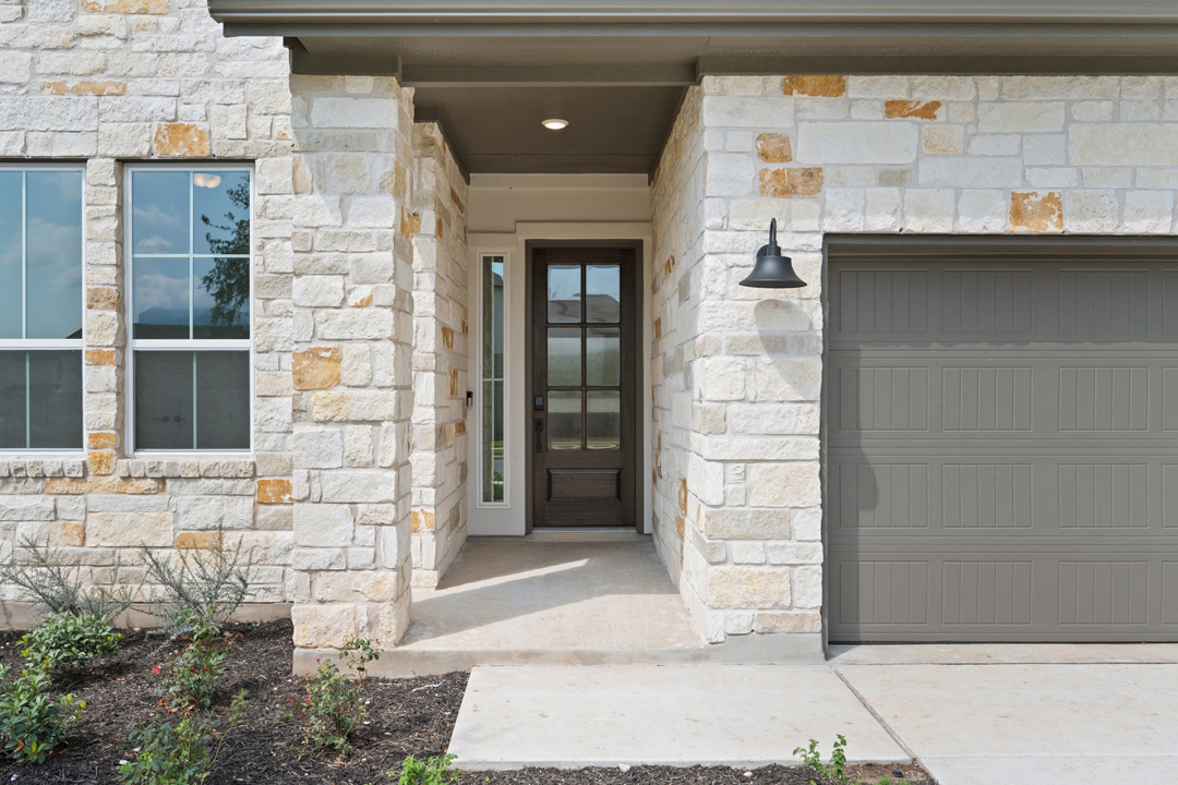 1114 Blue Moon Drive Georgetown, TX 78628 - Photo 2 of 39 a building with a door and a window