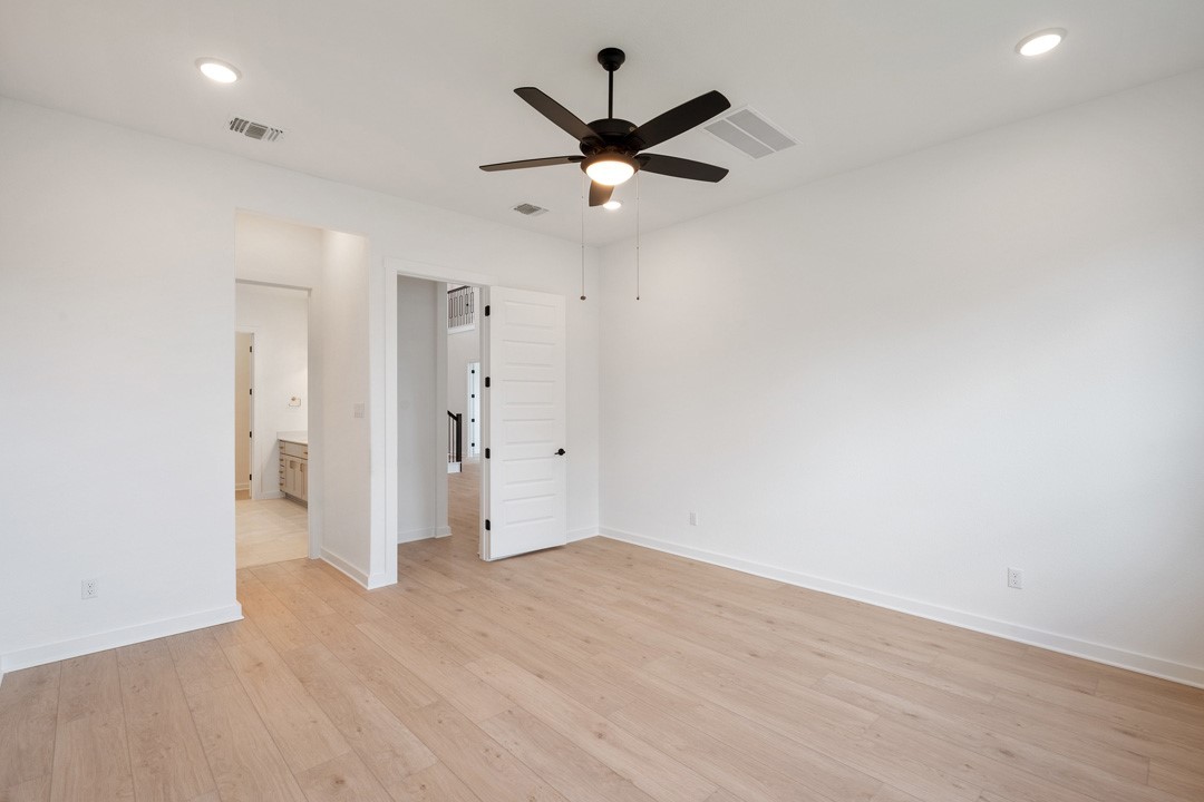 1114 Blue Moon Drive Georgetown, TX 78628 - Photo 22 of 39 an empty room with closet and a ceiling fan