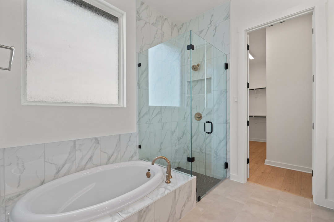1114 Blue Moon Drive Georgetown, TX 78628 - Photo 24 of 39 a bathroom with a bathtub and a shower