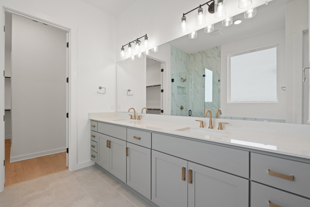 1114 Blue Moon Drive Georgetown, TX 78628 - Photo 25 of 39 a bathroom with a double vanity sink mirror and