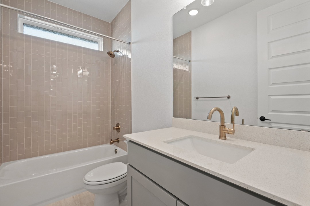 1114 Blue Moon Drive Georgetown, TX 78628 - Photo 31 of 39 a bathroom with a sink a toilet and shower