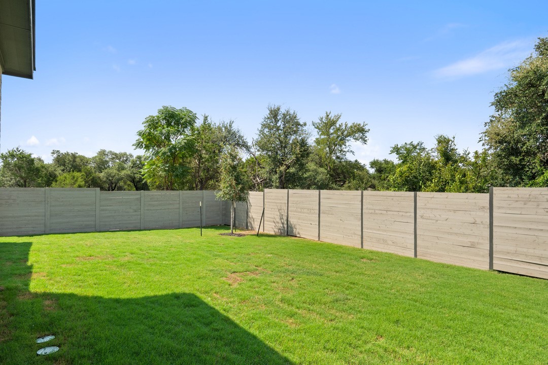 1114 Blue Moon Drive Georgetown, TX 78628 - Photo 39 of 39 a view of a backyard with a small cabin
