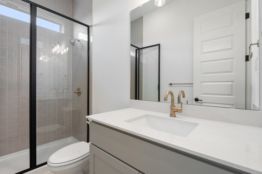 1114 Blue Moon Drive Georgetown, TX 78628 - Photo 5 of 39 a bathroom with a sink toilet and shower