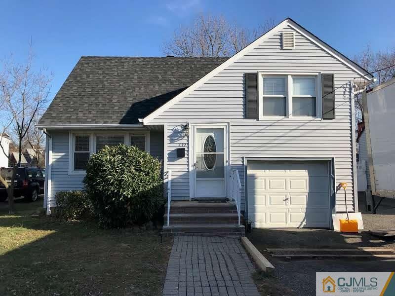 1019 Main Street Fords, NJ 08863 - Photo 1 of 13 a front view of a house with a yard