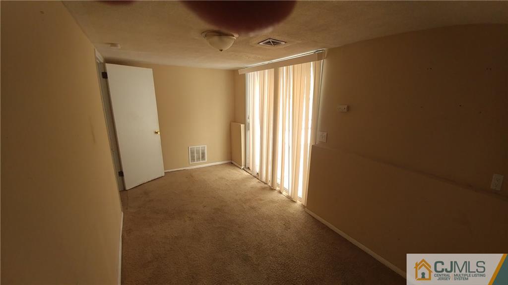 1019 Main Street Fords, NJ 08863 - Photo 12 of 13 a view of an empty room and a window