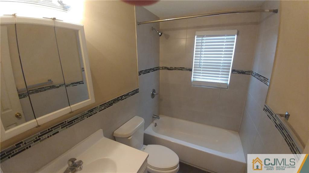 1019 Main Street Fords, NJ 08863 - Photo 6 of 13 a bathroom with a shower and a toilet