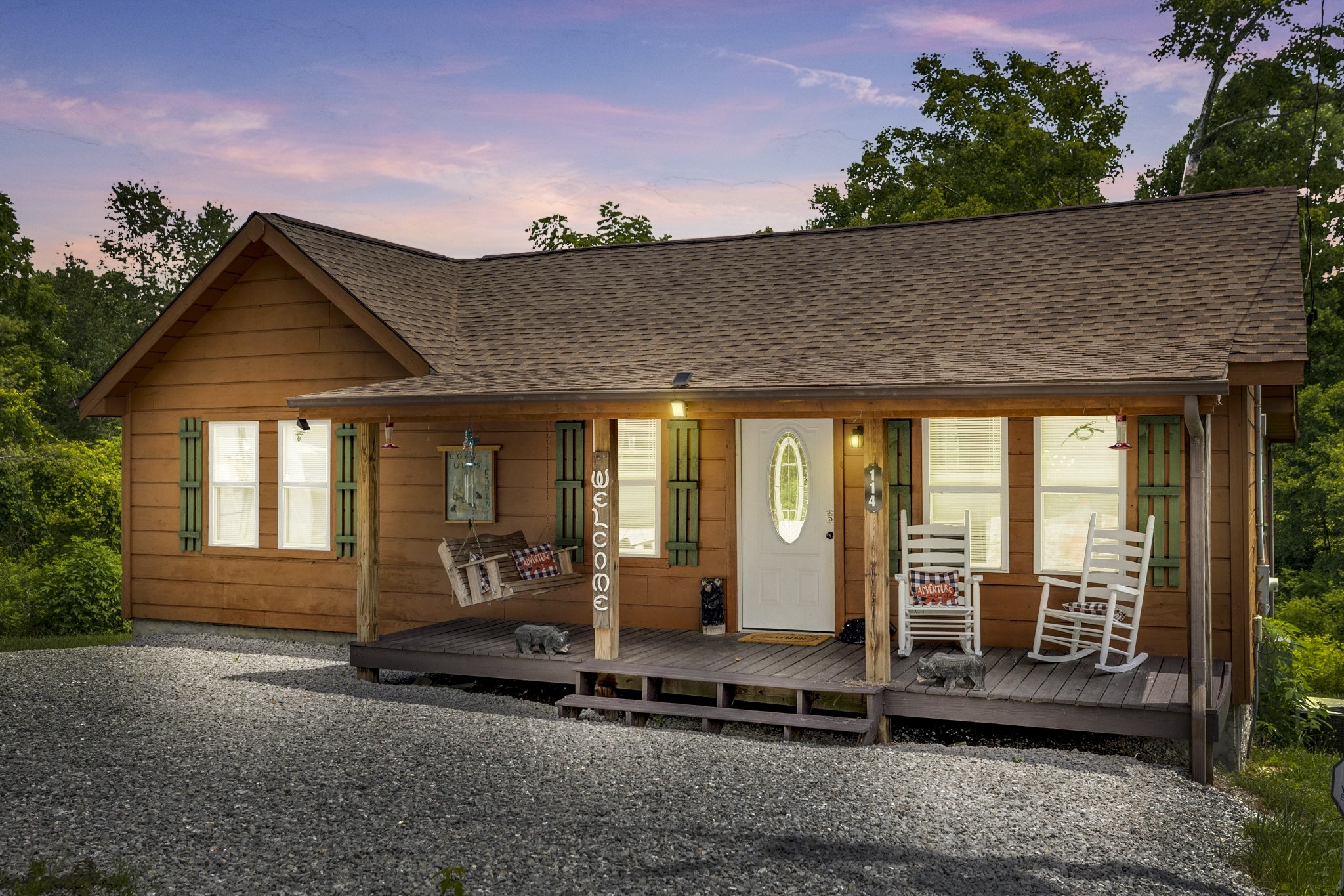 a view of a house with a floor to ceiling window and floor to ceiling window