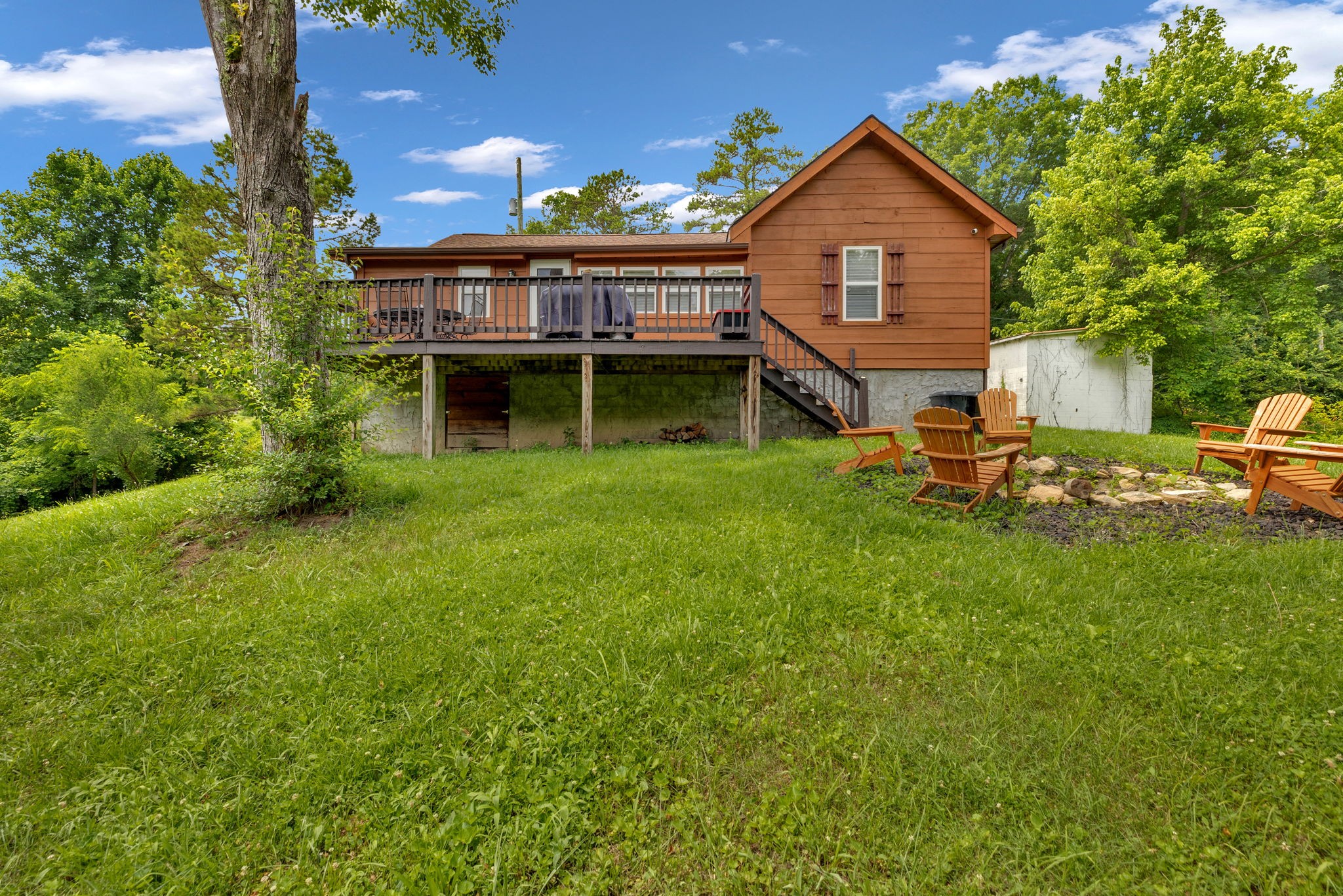 114 Ashley Road Jamestown, TN 38556 - Photo 24 of 29 a view of a house with a backyard and sitting area
