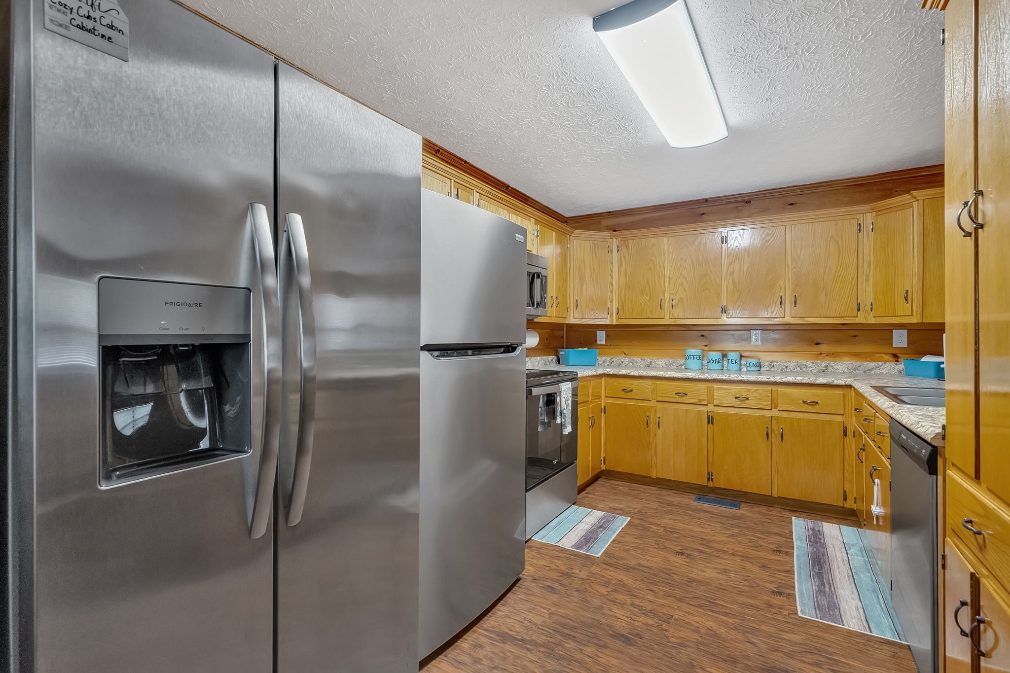 114 Ashley Road Jamestown, TN 38556 - Photo 9 of 29 a kitchen with a refrigerator sink and cabinets