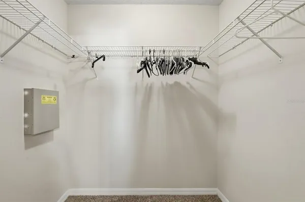 an empty room with windows and entrance