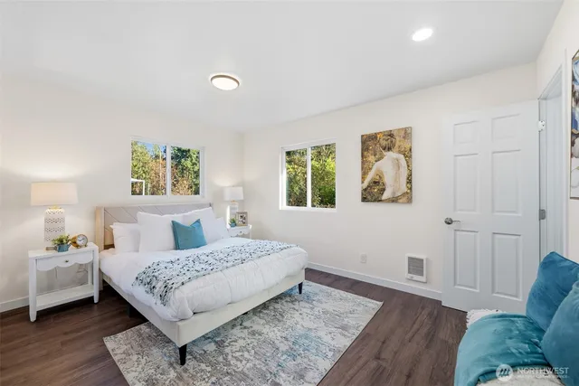 a living room with a bed furniture and a window