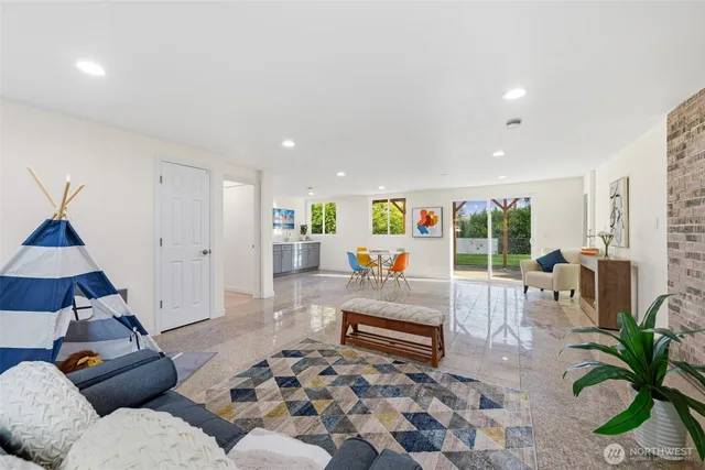 a living room with furniture and a rug