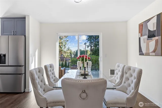 a living room with furniture lamp and a large window