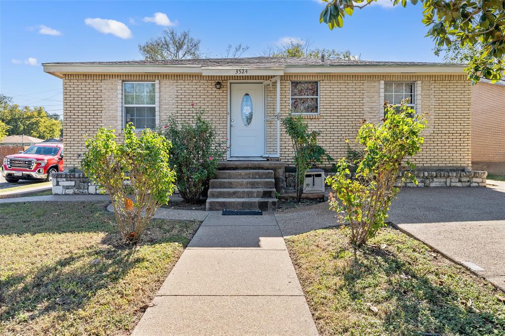 3524 Live Oak Avenue Waco, TX 76708 - Photo 1 of 19 a front view of a house with garden