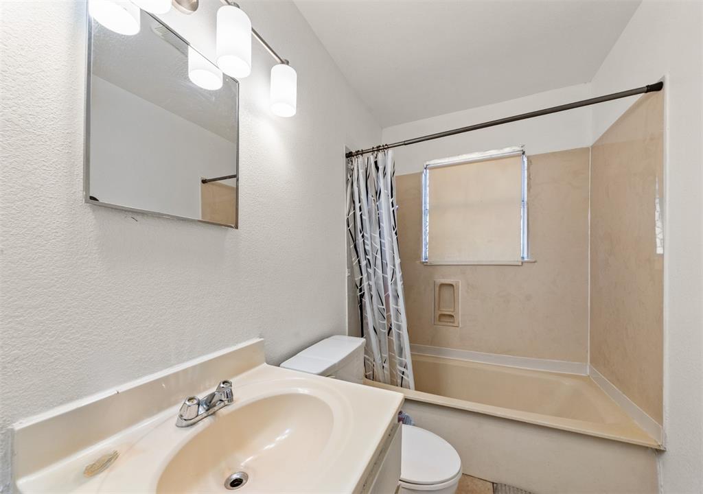 3524 Live Oak Avenue Waco, TX 76708 - Photo 11 of 19 a bathroom with a sink and a mirror