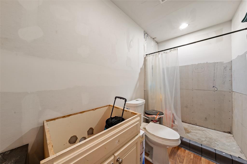 3524 Live Oak Avenue Waco, TX 76708 - Photo 17 of 19 a bathroom with a sink a toilet and shower