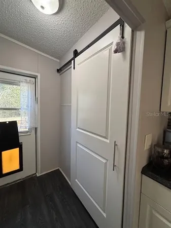 a view of a room with a flat screen tv