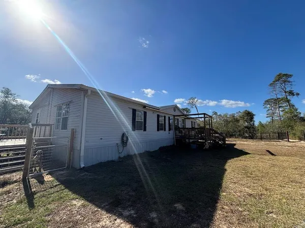a view of a backyard of the house