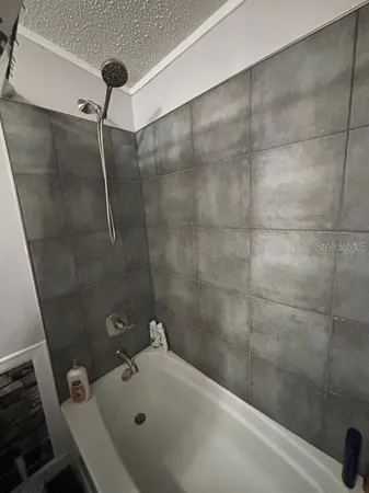 a bathroom with a sink and shower