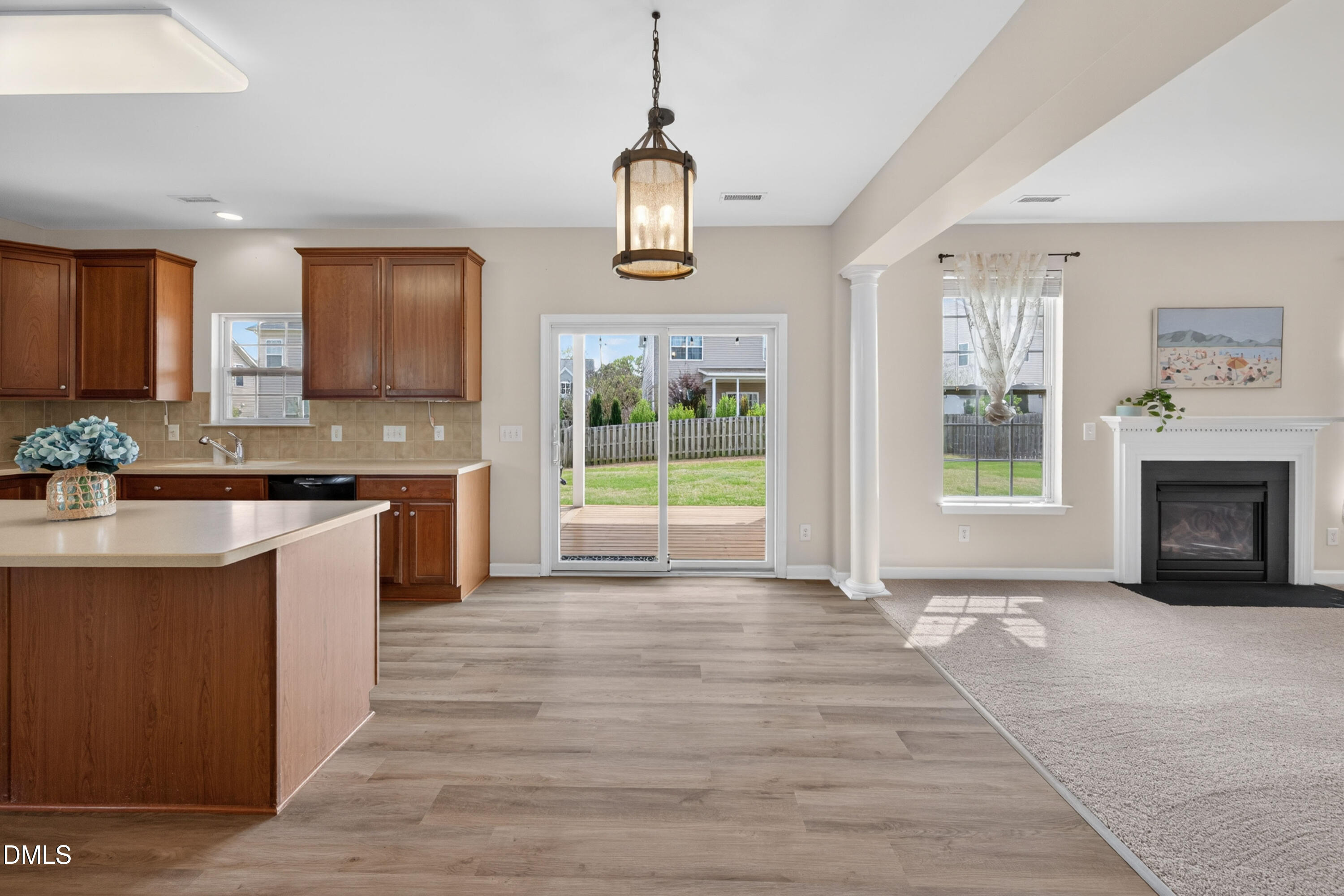 5304 Stone Station Drive Raleigh, NC 27616 - Photo 9 of 34 a kitchen with stainless steel appliances granite countertop a stove a sink and a wooden floors
