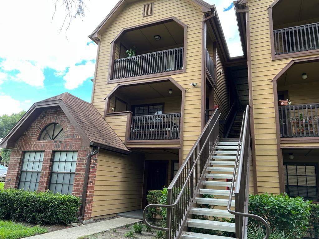 345 Lakepointe Drive, Unit 201 Altamonte Springs, FL 32701 - Photo 1 of 1 a front view of a house with entryway and deck