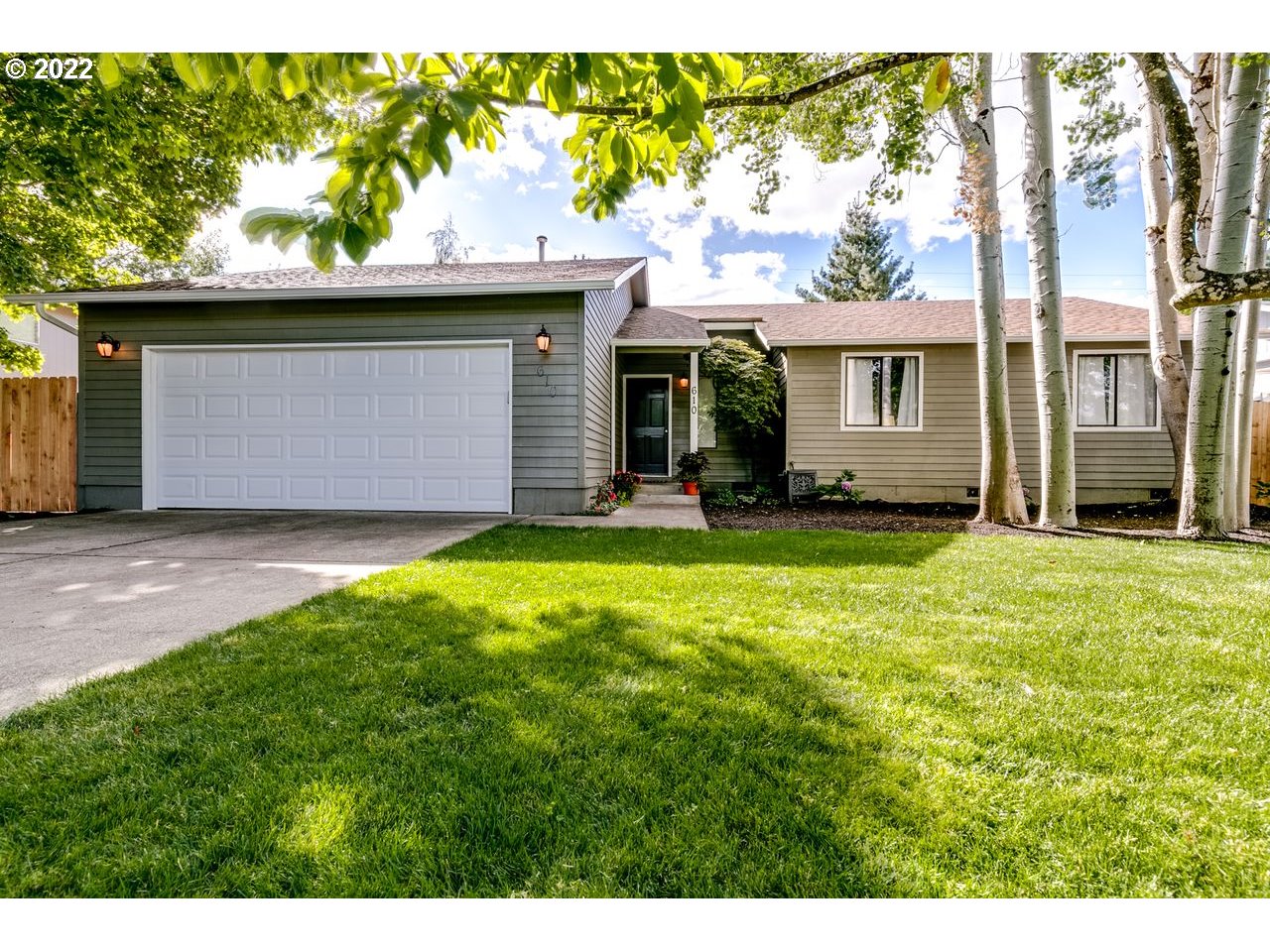 610 67th Place Springfield, OR 97478 - Photo 1 of 28 a front view of a house with a yard