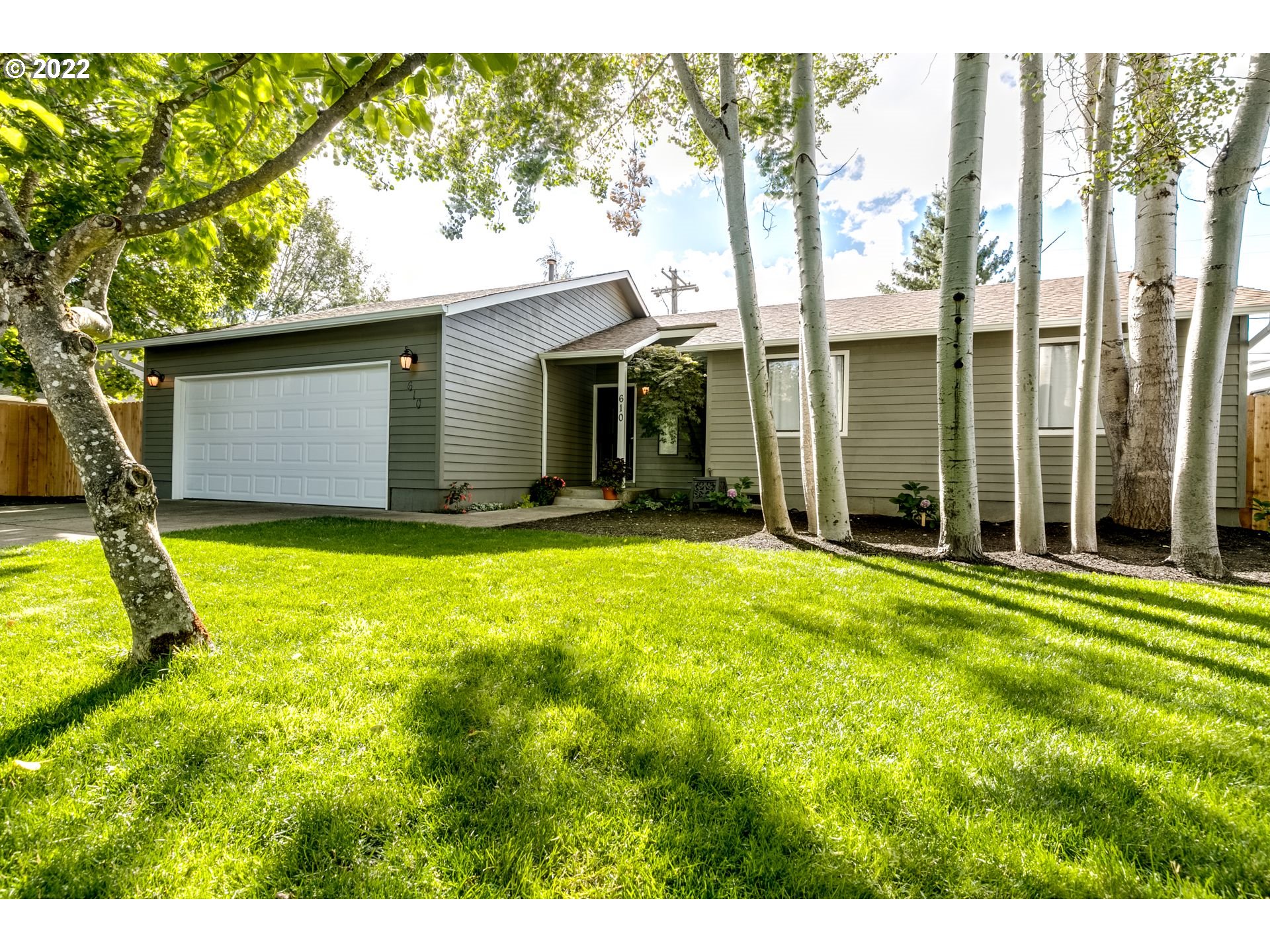 610 67th Place Springfield, OR 97478 - Photo 2 of 28 a view of backyard of house with green space